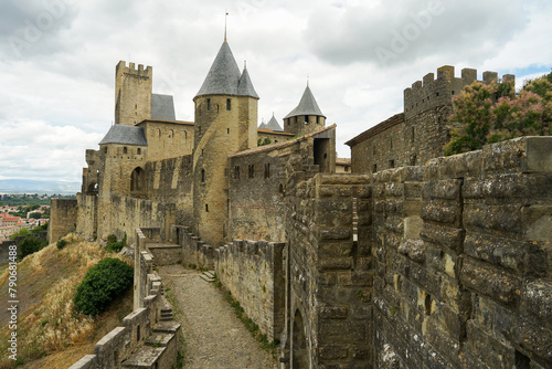 Carcassone castle with ramparts on sunny day, popular tourist landmark in France