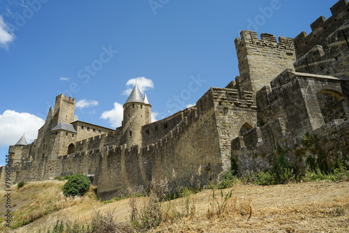 Carcassone castle with ramparts on sunny day, popular tourist landmark in France