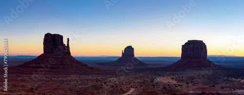View of three iconic rocks; West Mitten Butte, East Mitten Butte, and Merrick Butte at sunrise, Utah-Arizona photo
