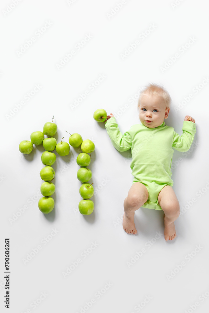 eleven month old infant on white background with pineapple eleven month old infant on white background with pineapple