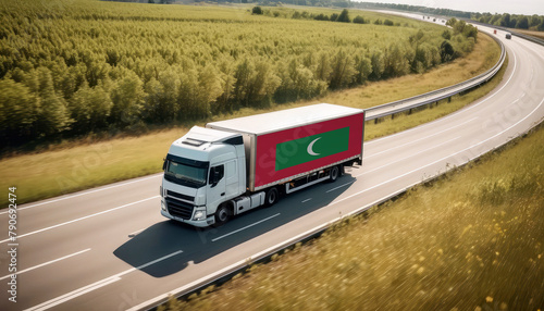 An Maldive-flagged truck hauls cargo along the highway, embodying the essence of logistics and transportation in the Maldive