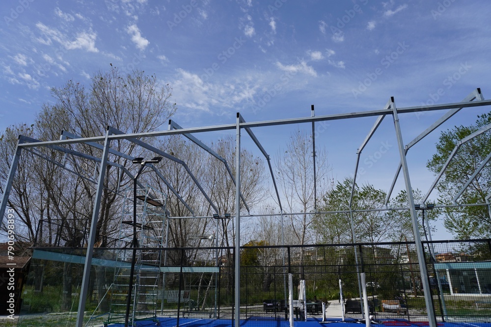 Installation of metal structures using a crane
against the blue sky Installation of metal structures using a crane
against the blue sky
