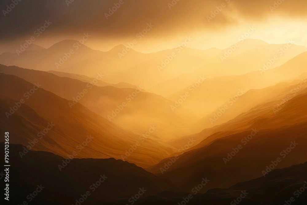 Stunning view of a mountain range bathed in golden light at sunrise.
