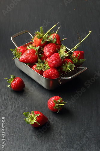 Strawberry fruits on a black background