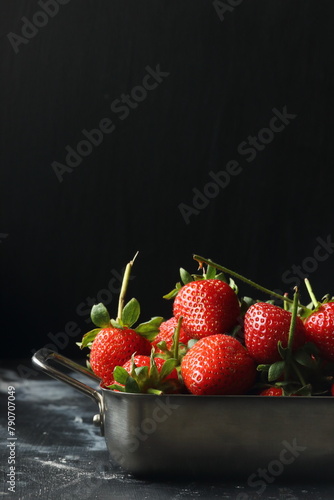 Strawberry fruits on a black background