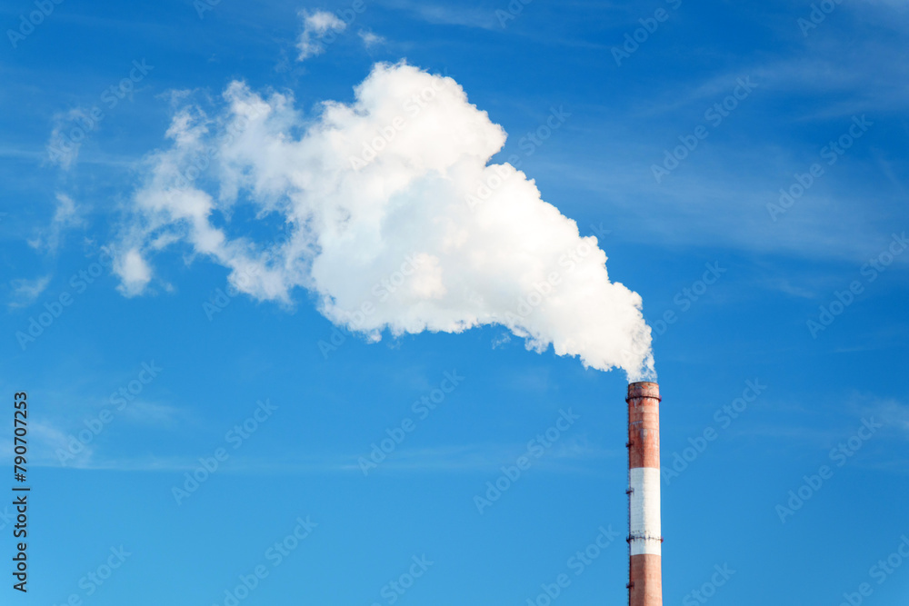 Smokestack emits thick creating a striking visual image of industrial pollution.