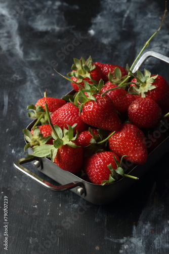 Strawberry fruits on a black background