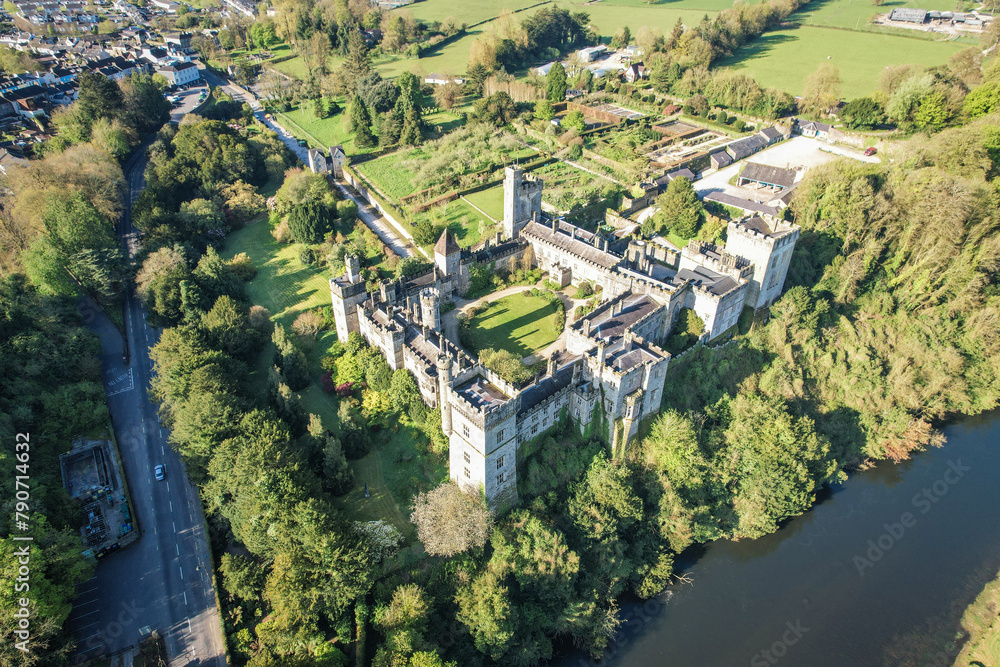 Behold Lismore Castle in County Waterford, Ireland, as if viewed through the eyes of an eagle, capturing every intricate detail of its historic grandeur from above