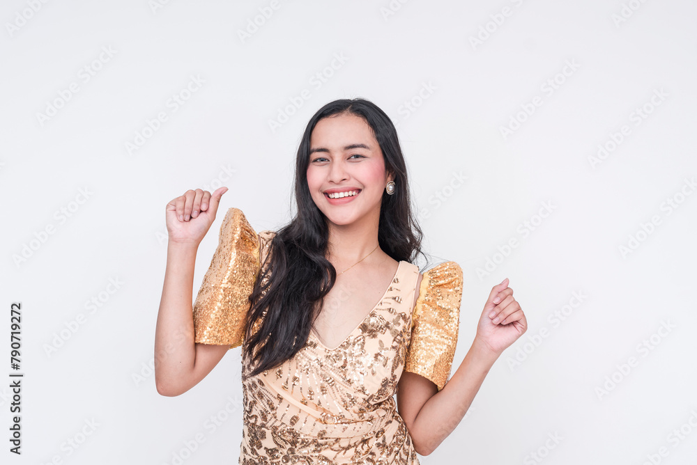Joyful Filipino woman in a champagne Filipiniana dress, celebrating on a white background Joyful Filipino woman in a champagne Filipiniana dress, celebrating on a white background