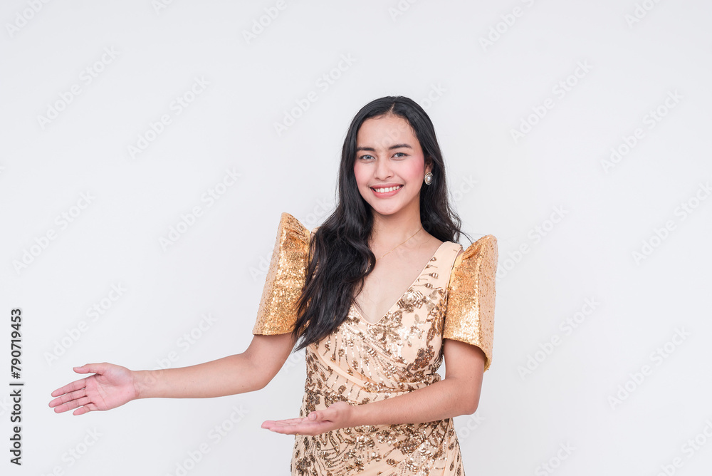 Elegant Filipino woman in traditional Filipiniana dress presenting on white background Elegant Filipino woman in traditional Filipiniana dress presenting on white background