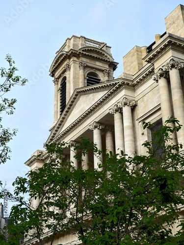 Paris, April 2024 : Visit of the magnificent city of Paris, Capital of France - View on different facades of buildings built by Baron Haussmann