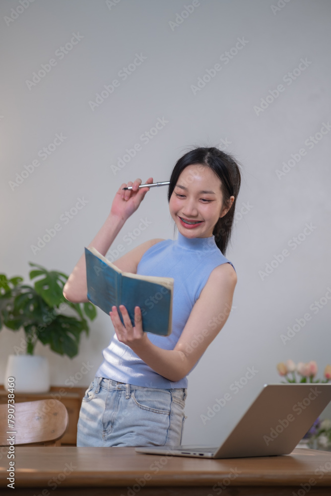 Happy Asian woman education learning by technology e-learning by computer, Learning online on internet Happy Asian woman education learning by technology e-learning by computer, Learning online on internet