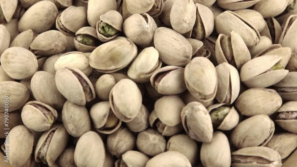 Pistachios in a wooden bowl. Wooden background. Healthy food Pistachios in a wooden bowl. Wooden background. Healthy food