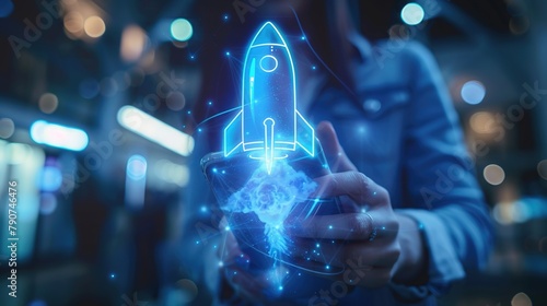 Close-up of a woman's hand clutching a phone against an illusive office background featuring an abstract, shimmering blue rocket spaceship. photo