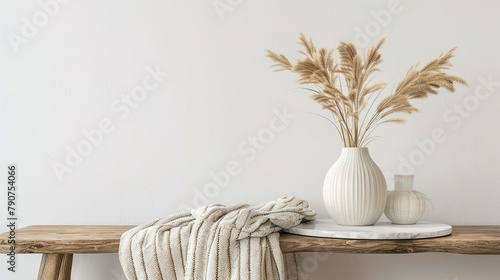 Dehydrated Lagurus ovatus grass in a contemporary white ceramic vase  photo