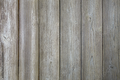abstract background of an old shabby painted light wooden fence texture close up photo
