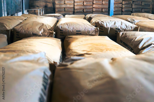 Warehouse full of paper sacks with tea. Producing process in tea factory in Sri Lanka..