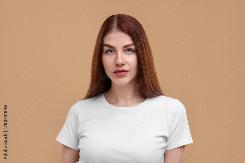 Portrait of beautiful woman with freckles on beige background Portrait of beautiful woman with freckles on beige background