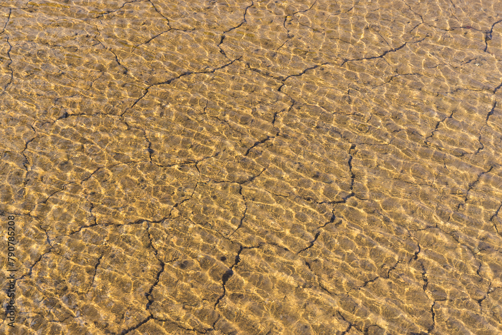 Water though the cracks on the drought land Water though the cracks on the drought land