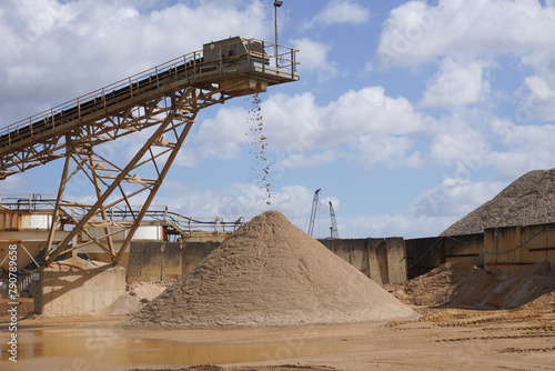 Sand conveyor at aggregates site. industrial machinery and materials for construction 