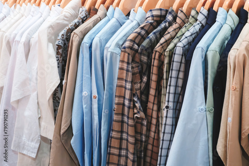 A rack of clothes with a variety of colors and patterns