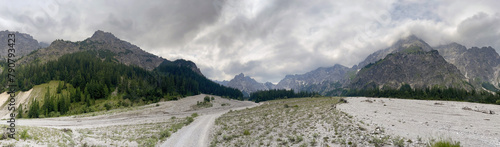 Panoramic view across the Wimbachtal mountain range with a dry river bed