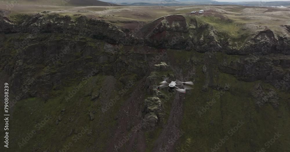 Aerial Panning Shot Of Drone Flying Over Tranquil Rock Formations Against Cloudy Sky - Unknown, Iceland Aerial Panning Shot Of Drone Flying Over Tranquil Rock Formations Against Cloudy Sky - Unknown, Iceland