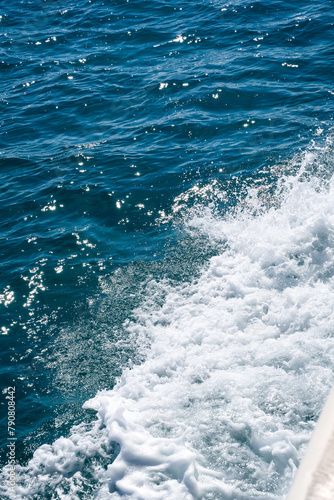 Obraz na płótnie Splash of white foam in the water created by movement of a boat in the sea w salonie