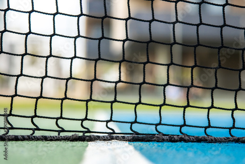 A tennis net with a blue background