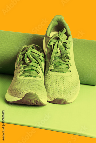 Sneakers and yoga mat. Fitness and healthy lifestyle concept.