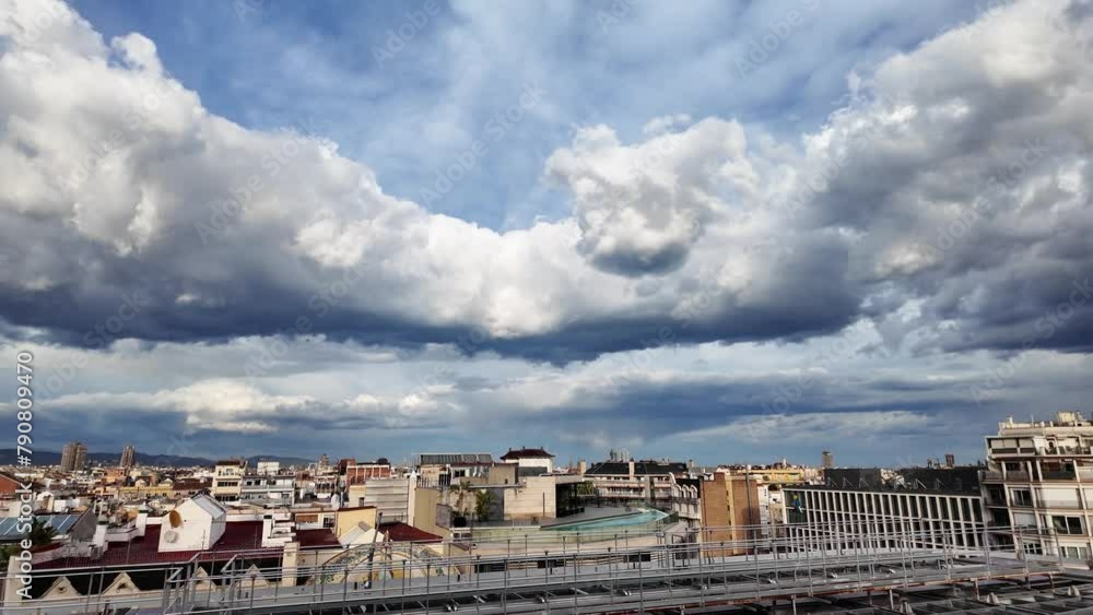 Cityscape view of rooftops of buildings in Barcelona with stormy clouds above, 4K Cityscape view of rooftops of buildings in Barcelona with stormy clouds above, 4K