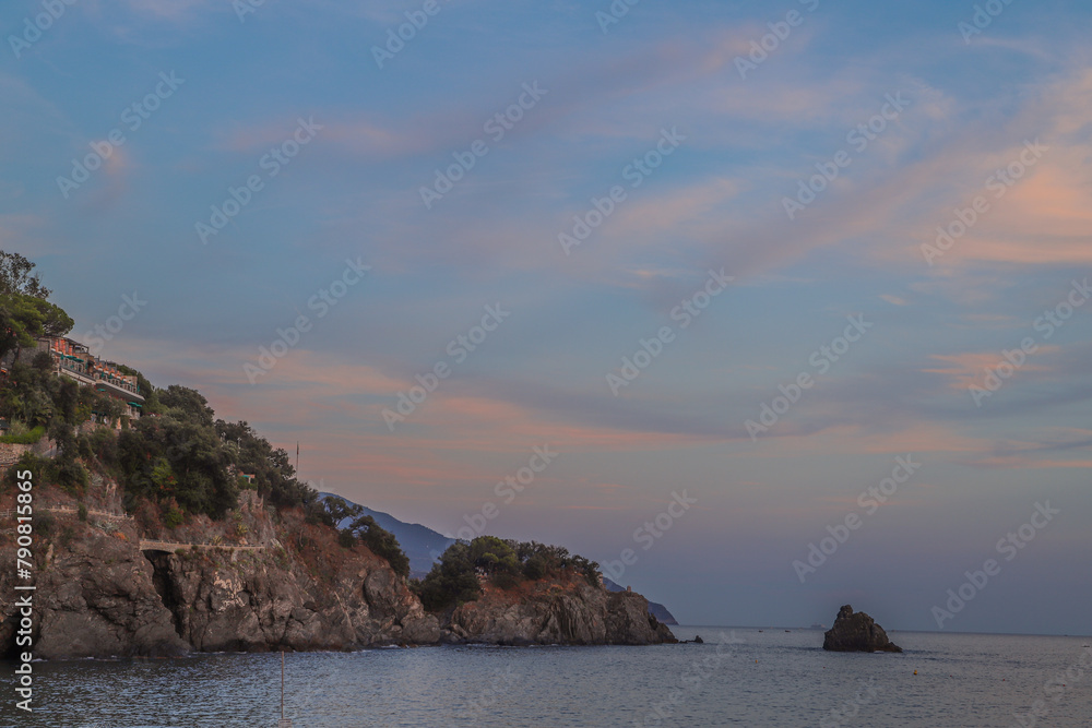 Seaside Sunset Over Rolling Hills