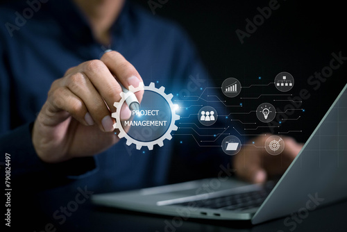 Project management concept . business hand working with project manager and icons about planning tasks and milestones on schedule , cost management of Ui computer . © A Stockphoto