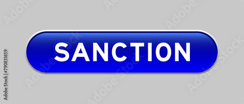 Blue color capsule shape button with word sanction on gray background