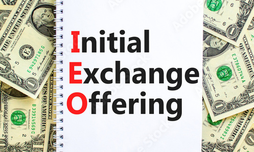 IEO initial exchange offering symbol. Concept words IEO initial exchange offering on beautiful note. Beautiful dollar bills background. Business IEO initial exchange offering concept. Copy space.