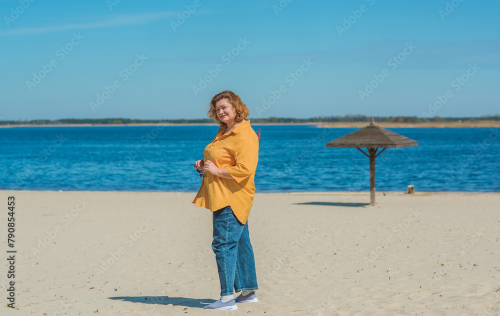 Pretty American middle age woman in vacation or at city. Size plus and xxl woman. Life of plump people in everyday life, faith in herself. Concept of life modern woman