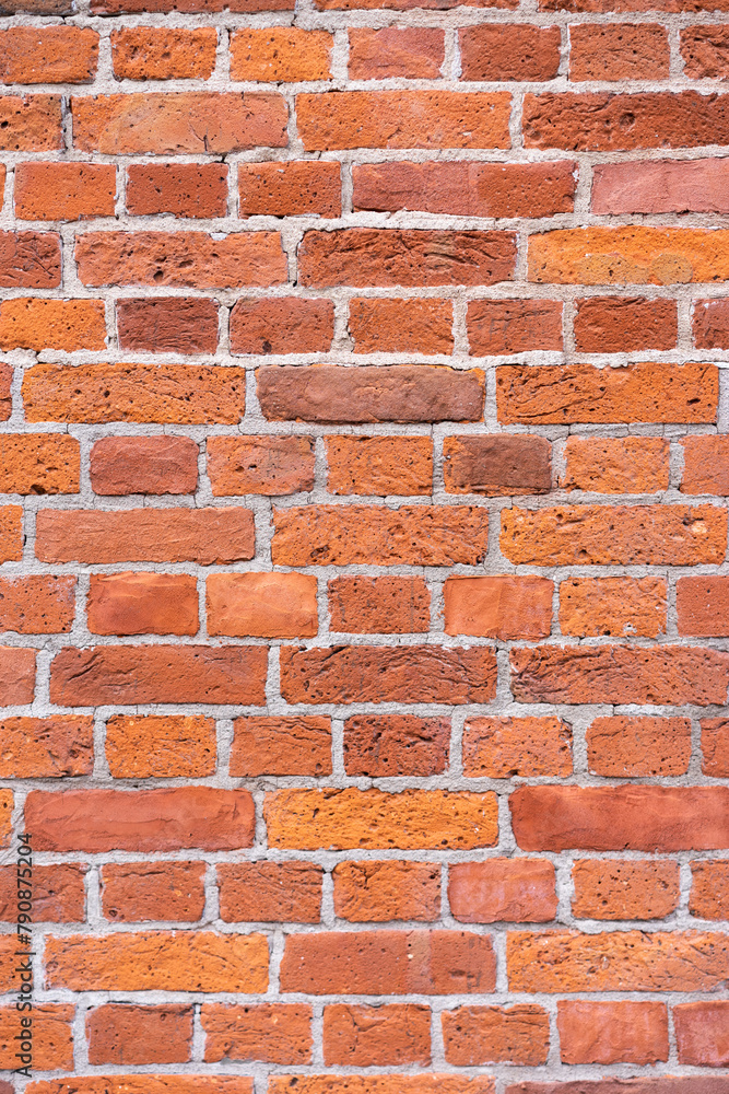 Fototapeta premium Empty brick red wall. background of a old brick house.