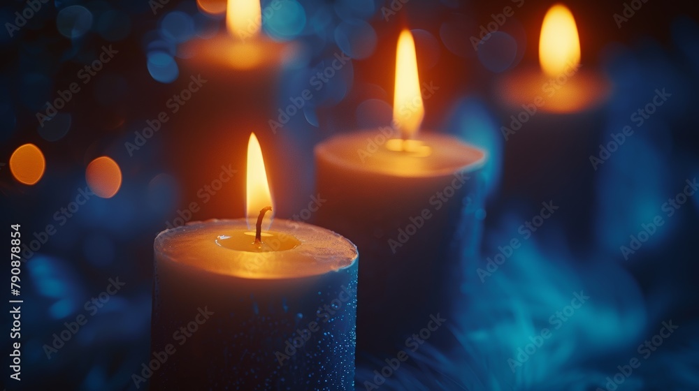 Candles glowing warmly with a tranquil blue bokeh background creating a peaceful ambiance Candles glowing warmly with a tranquil blue bokeh background creating a peaceful ambiance