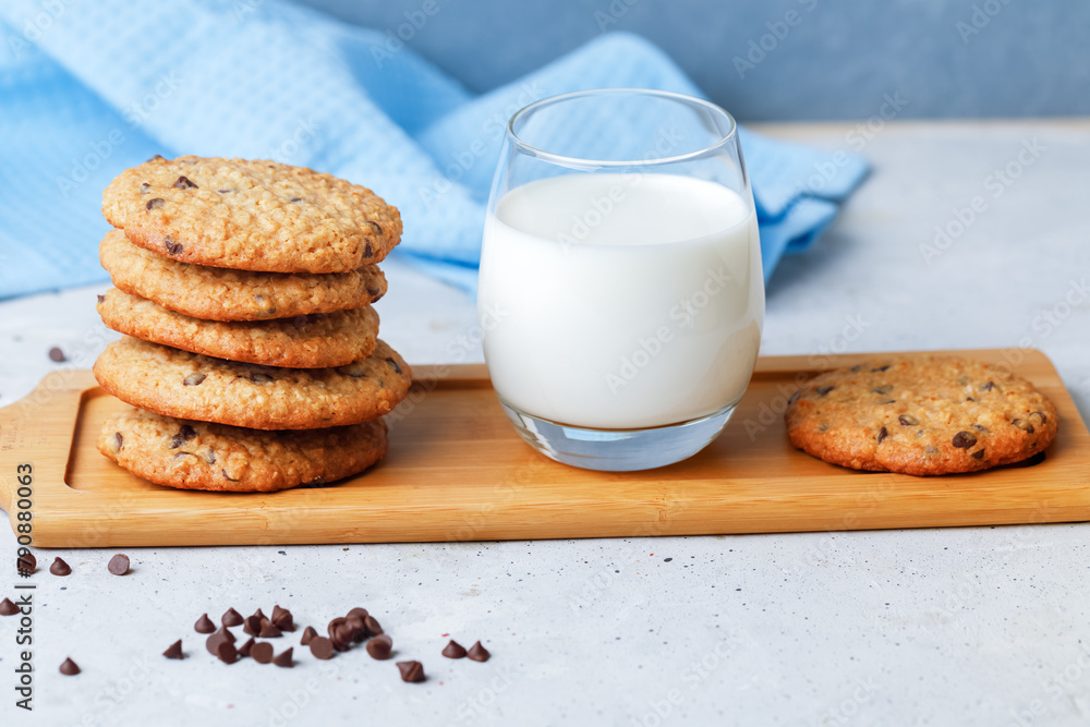 Oats Cookies With Chocolate Drops, Honey And Glass Of Milk. Side View On Grey Background. Oats Cookies With Chocolate Drops, Honey And Glass Of Milk. Side View On Grey Background.
