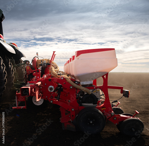 Tractor and seeder for sowing corn