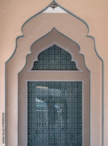 Interior diminishing perspective view with gable partitions wall inside Bang O mosque leading into glass wall. Mosque architecture and art concept, Space for text, Selective focus.