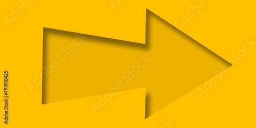 Yellow paper cut into holes arrow shape.