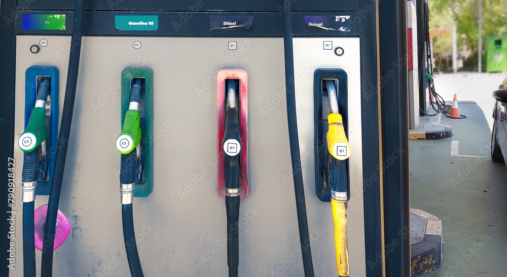 A gas station with different colored pumps. Gasoline, diesel of different octane ratings. A gas station with different colored pumps. Gasoline, diesel of different octane ratings.
