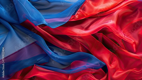 Flowing red and blue silk fabrics captured in a breeze photo