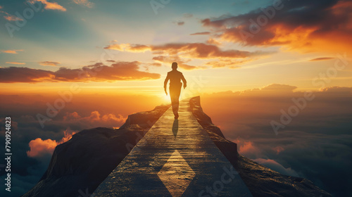 A man's silhouette is captured while running upwards on a mountain peak against a breathtaking sunrise, symbolizing victory
