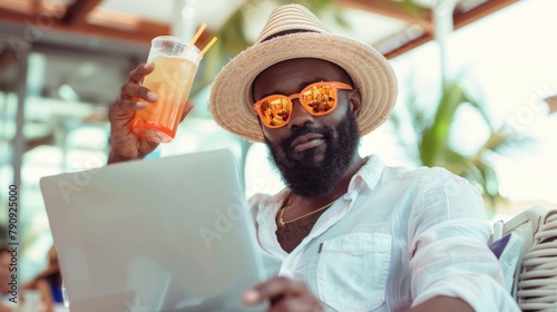 Man with Laptop on Tropical Getaway photo