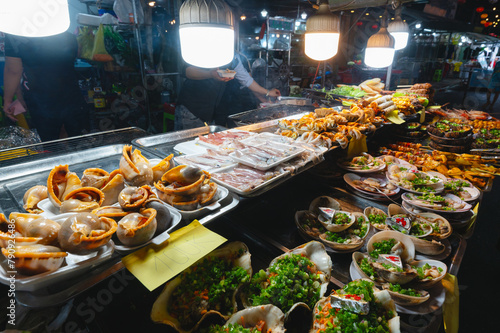A stall with various delicacies at the night market in Vietnam