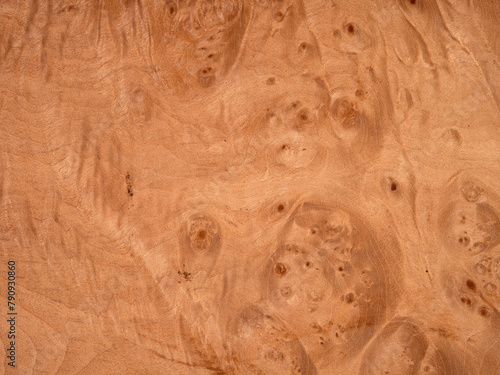 Maple briar veneer with unique, swirling eye patterns and warm tones