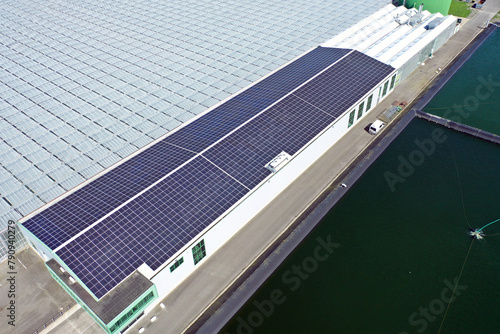 Solar panels on a large building. Solar panels provide free energy from the sun.