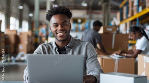 Smiling Employee at Warehouse Laptop